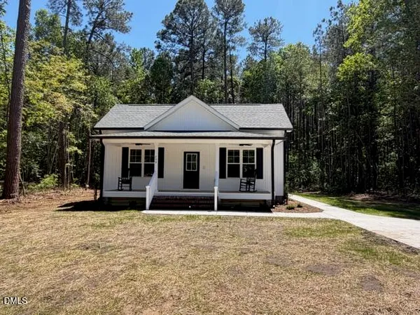 a house with trees in the background