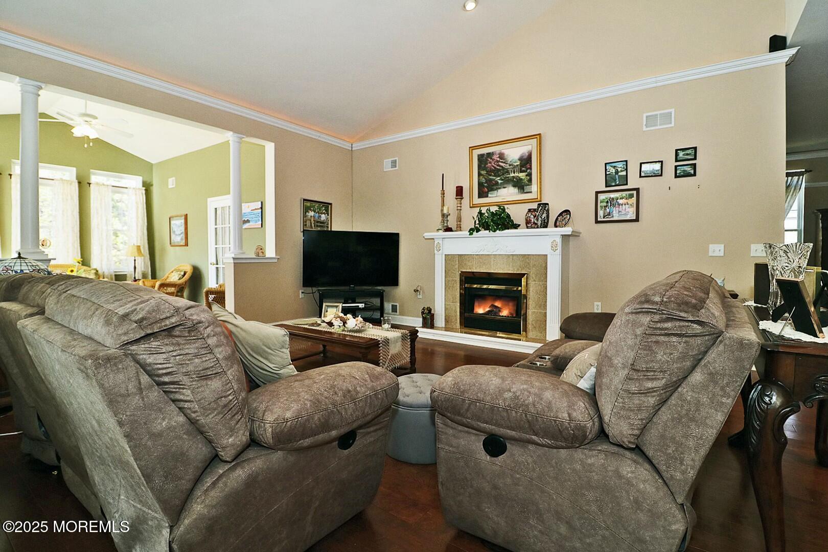 2 Manasquan Road Waretown, NJ 08758 - Photo 21 of 91 a living room with furniture a flat screen tv and a fireplace