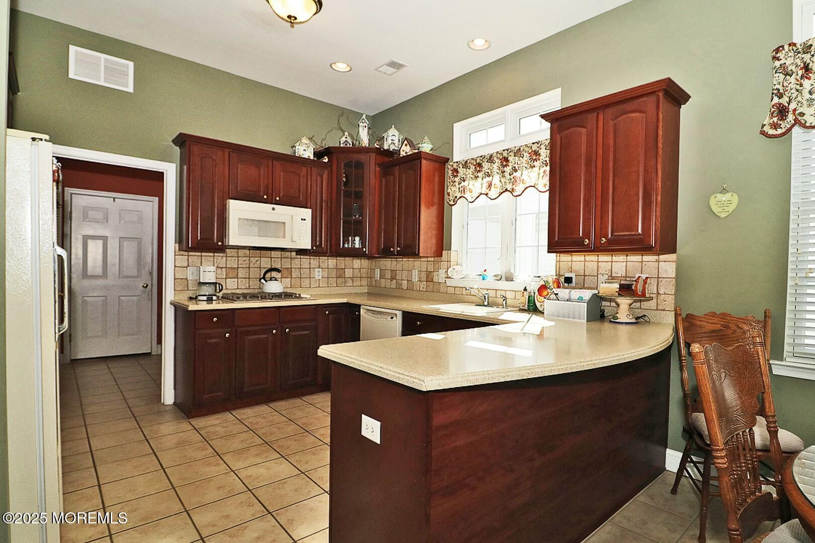 2 Manasquan Road Waretown, NJ 08758 - Photo 22 of 91 a kitchen with a sink appliances and cabinets