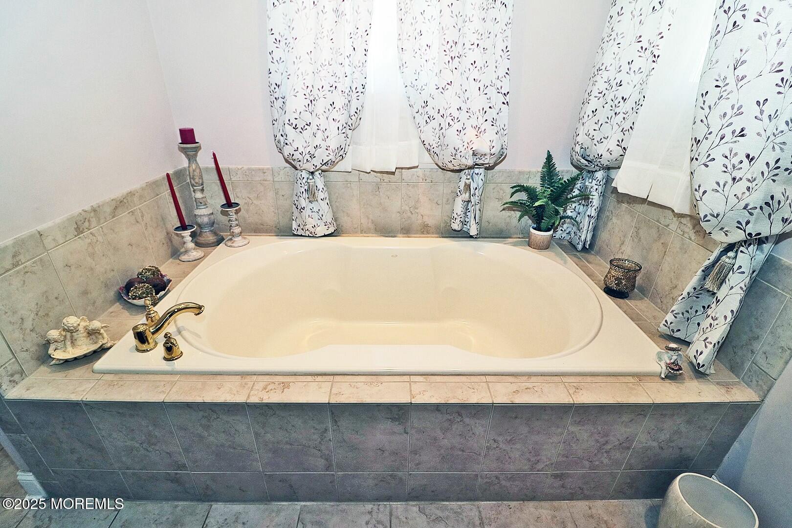 2 Manasquan Road Waretown, NJ 08758 - Photo 36 of 91 a bathroom with a bathtub and mirror