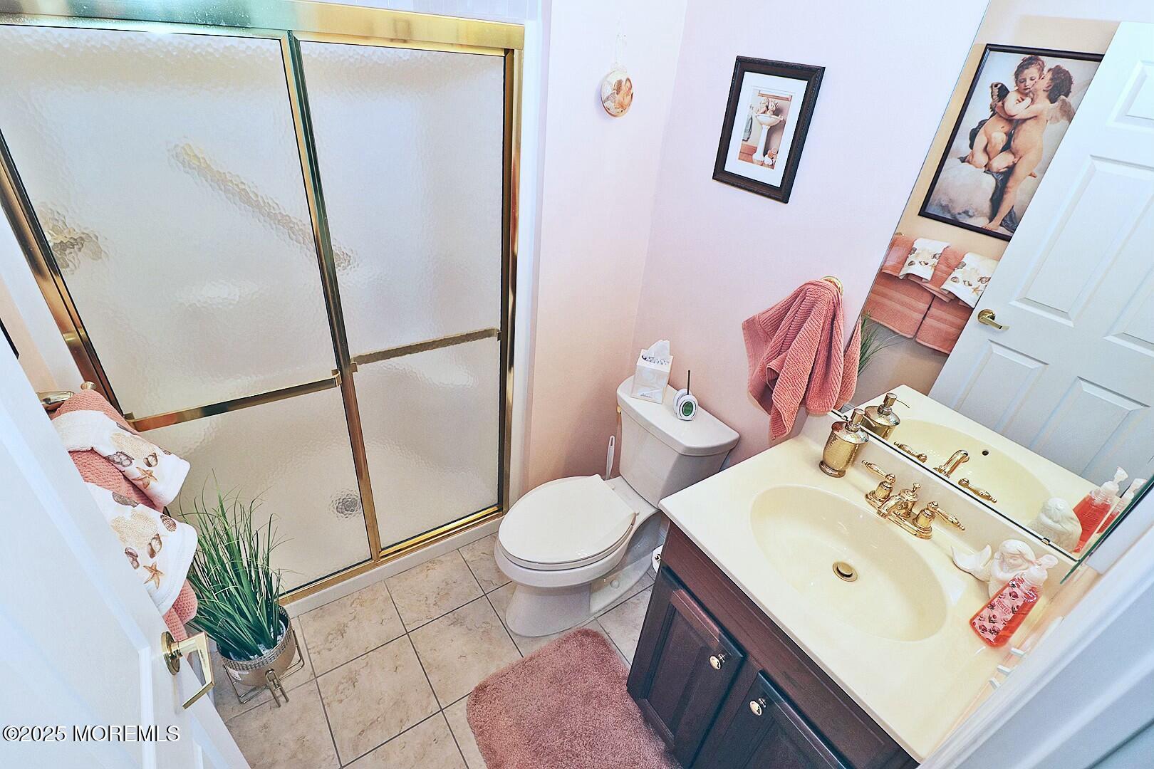 2 Manasquan Road Waretown, NJ 08758 - Photo 39 of 91 a white toilet sitting next to a bathroom sink