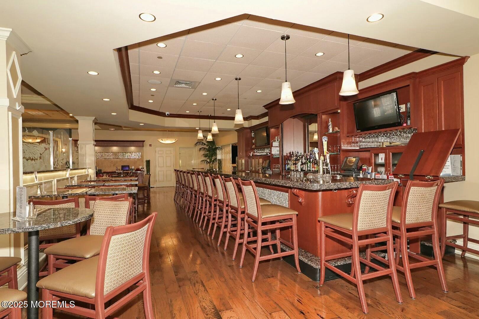 2 Manasquan Road Waretown, NJ 08758 - Photo 65 of 91 a view of a dining room with furniture wooden floor and chandelier