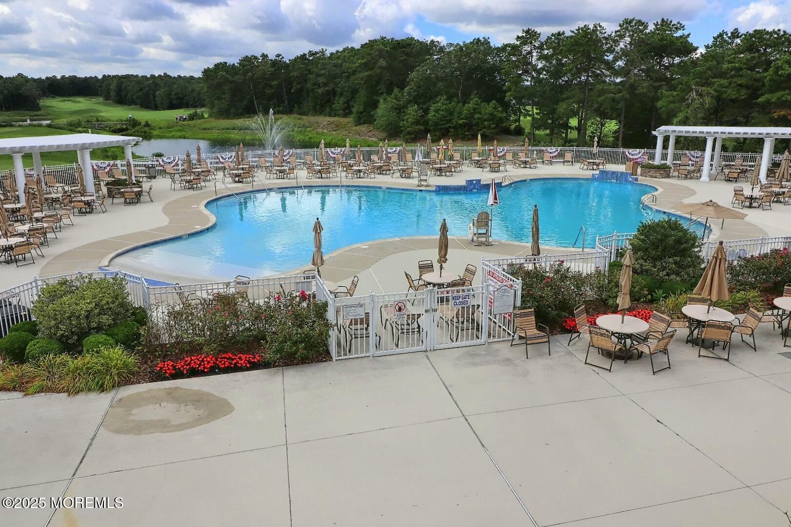 2 Manasquan Road Waretown, NJ 08758 - Photo 86 of 91 a view of a patio with couches chairs and a potted plant