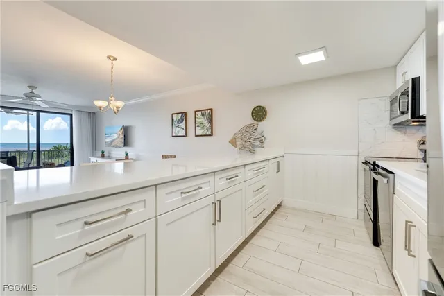 a spacious bathroom with a double vanity sink a mirror a vanity and a bathtub