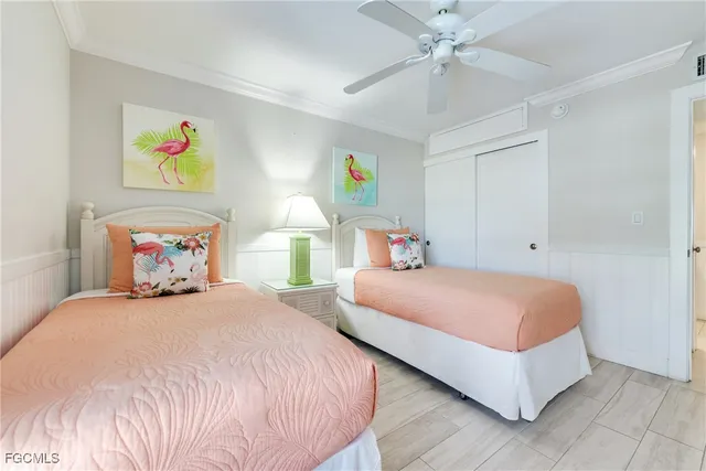 a bedroom with a bed and ceiling fan