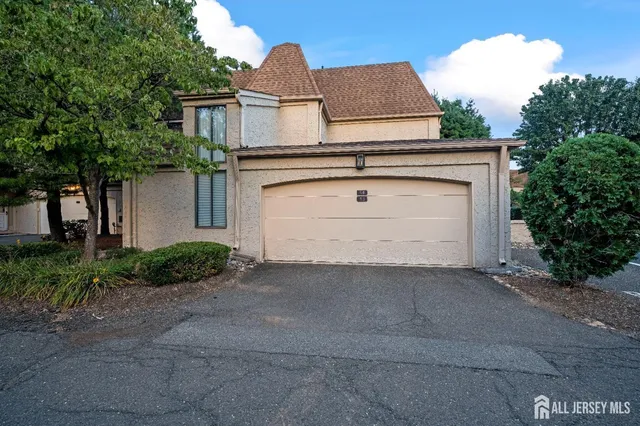 a view of a house with a yard and plants