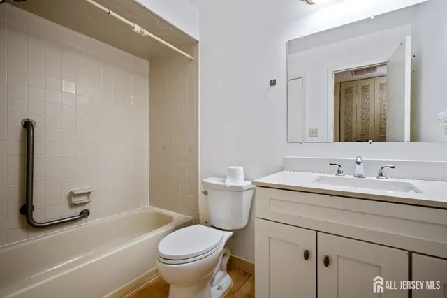 a bathroom with a sink toilet and a tub