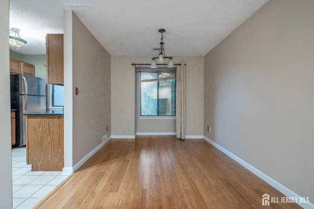 a view of livingroom with hardwood floor and a ceiling fan