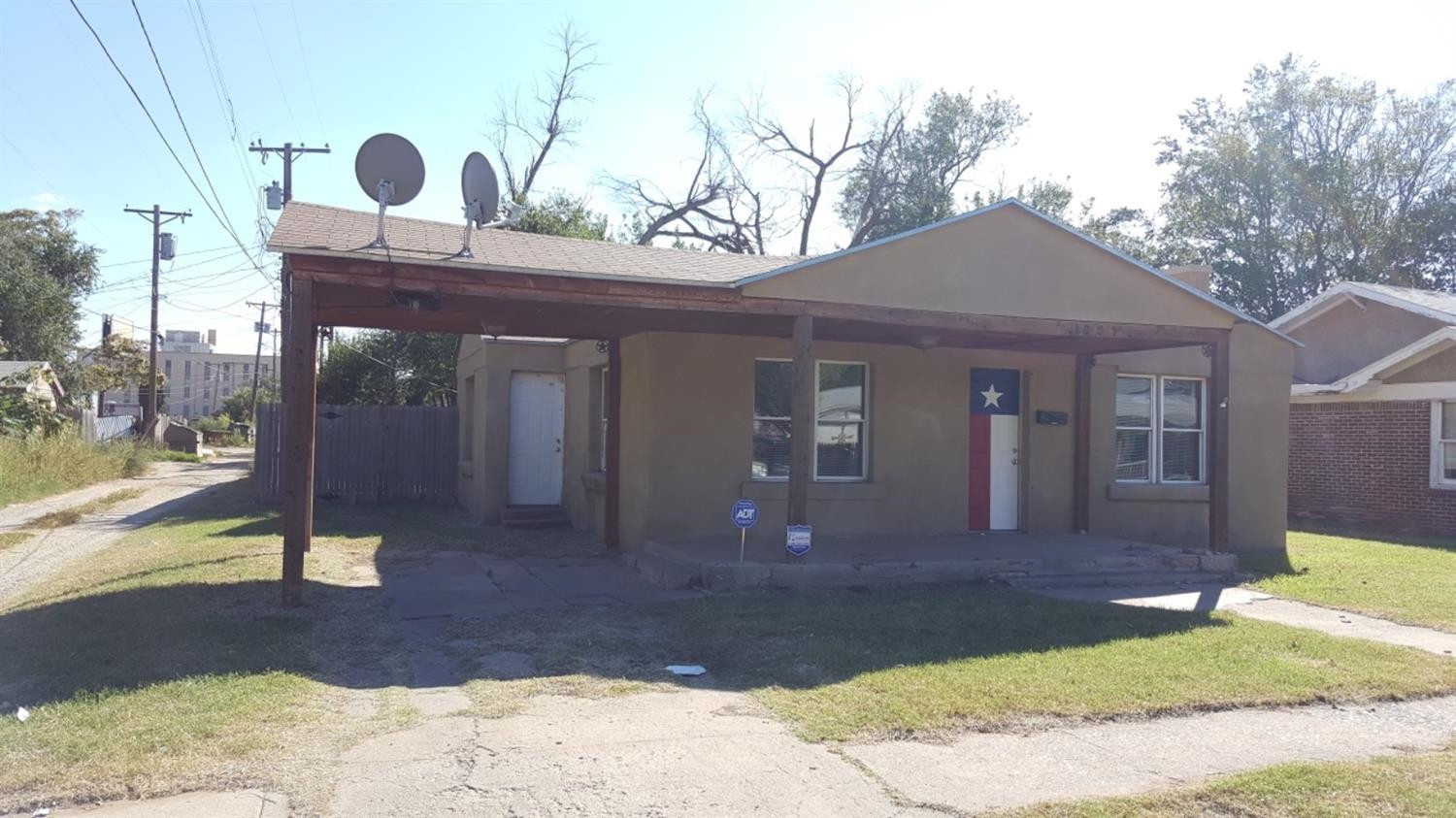 1807 18th Street Lubbock, TX 79401 - Photo 16 of 27 a front view of a house with a yard
