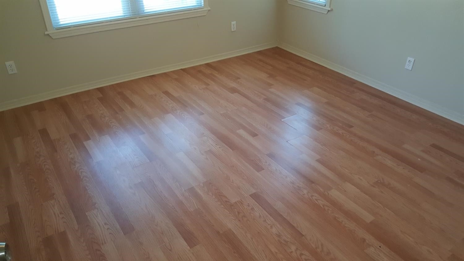 1807 18th Street Lubbock, TX 79401 - Photo 17 of 27 a view of a room with wooden floor and windows