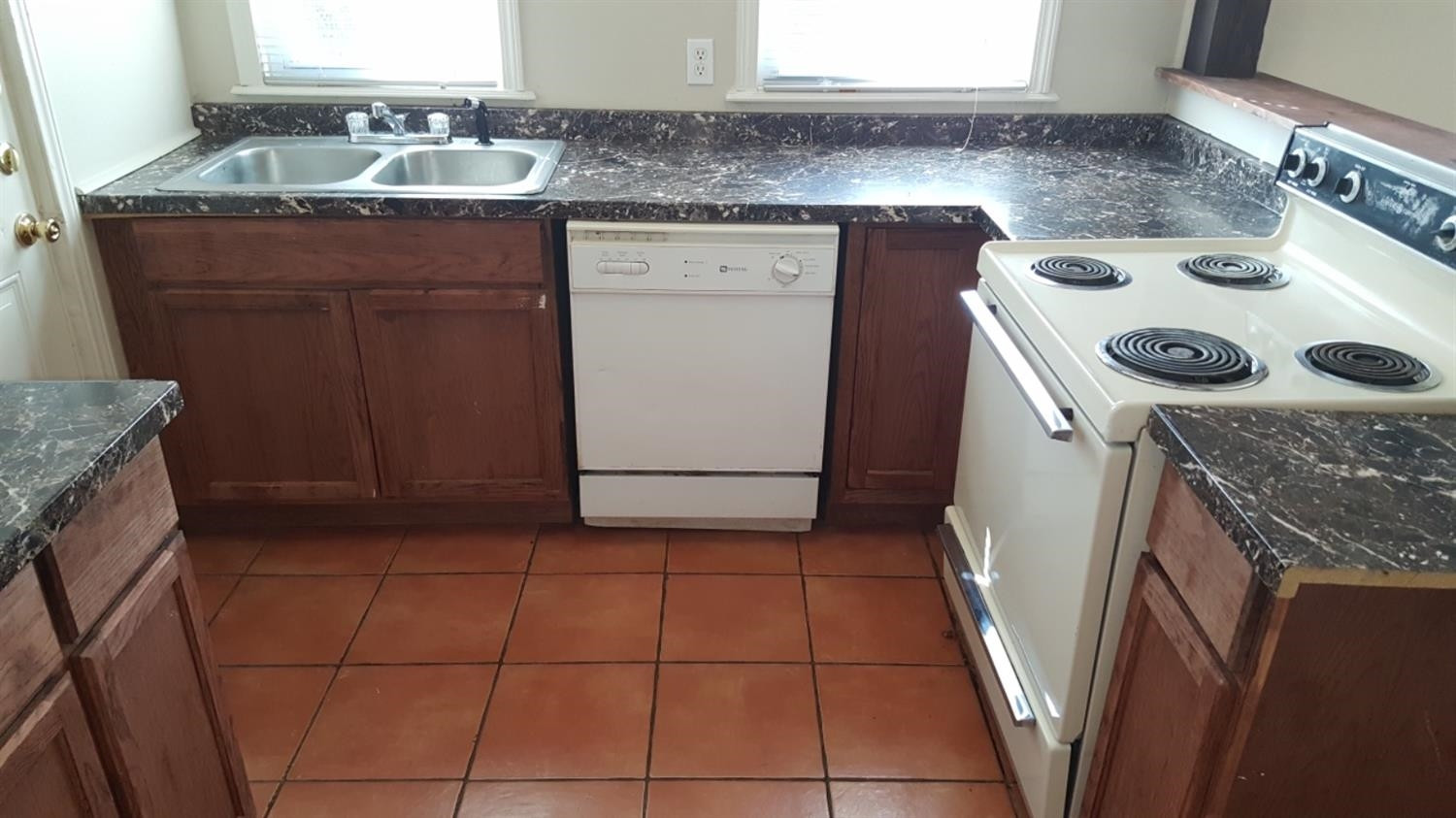 1807 18th Street Lubbock, TX 79401 - Photo 24 of 27 a utility room with a sink washer and dryer