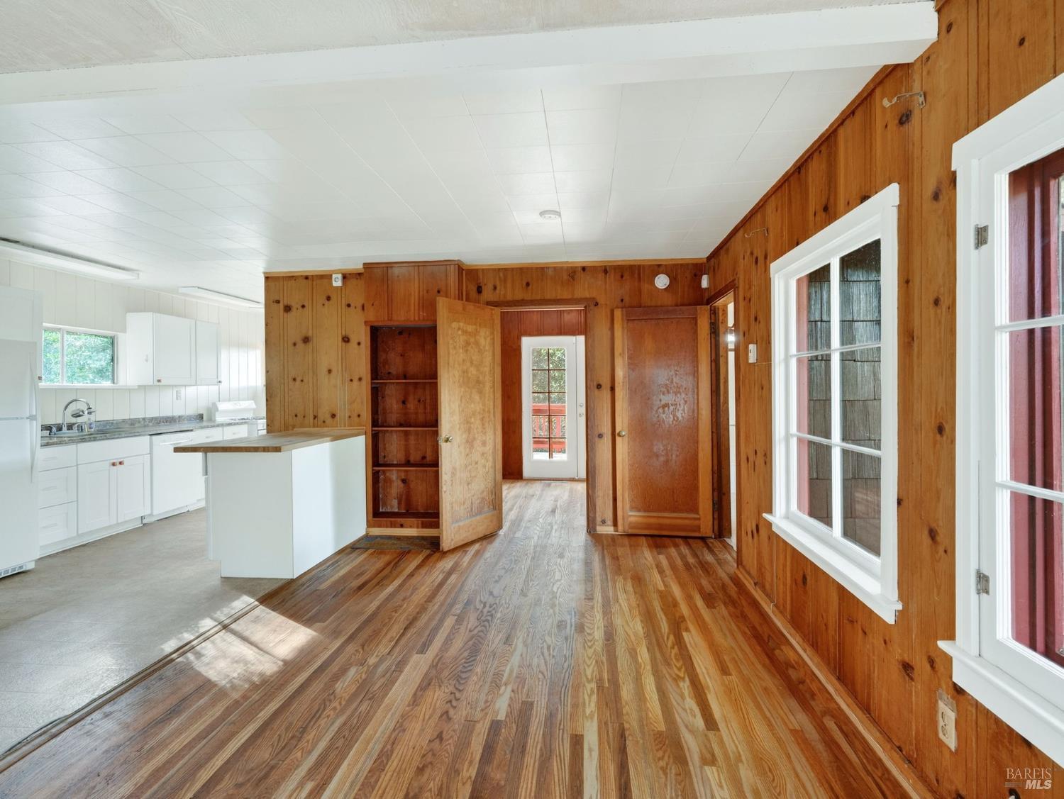 10701 Orr Springs Road Ukiah, CA 95482 - Photo 11 of 52 a spacious bathroom with a walk in closet a mirror and wooden floor