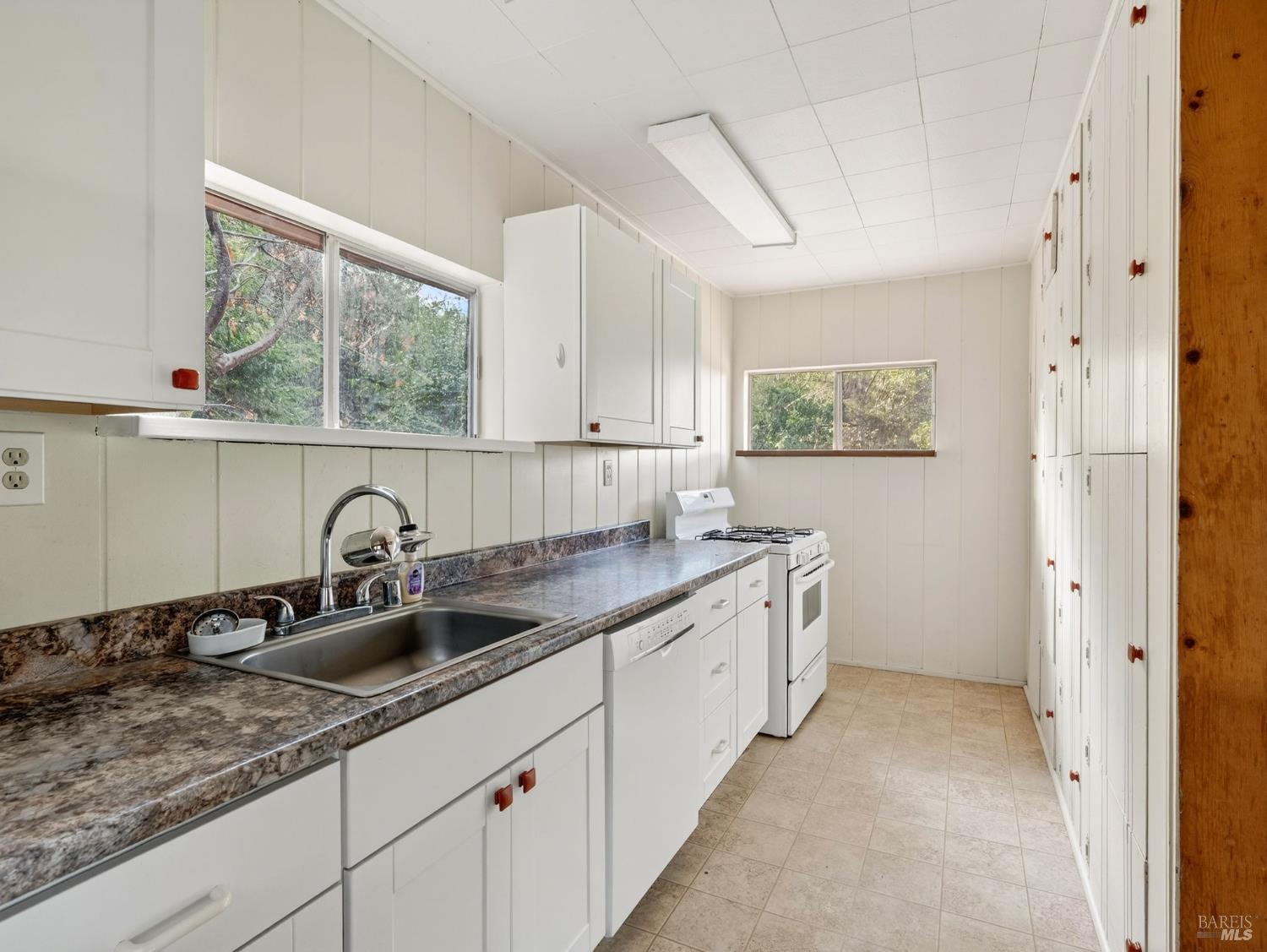 10701 Orr Springs Road Ukiah, CA 95482 - Photo 14 of 52 a kitchen with a sink and cabinets