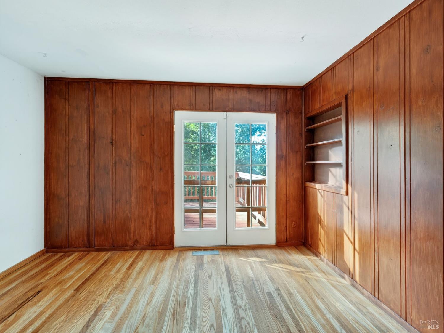 10701 Orr Springs Road Ukiah, CA 95482 - Photo 20 of 52 a view of an empty room with wooden floor and a window