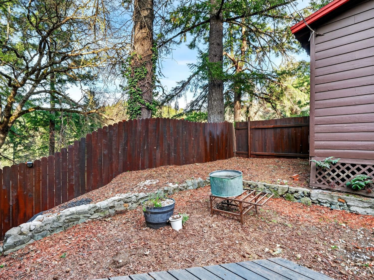 10701 Orr Springs Road Ukiah, CA 95482 - Photo 36 of 52 a backyard of a house with dining table and chairs