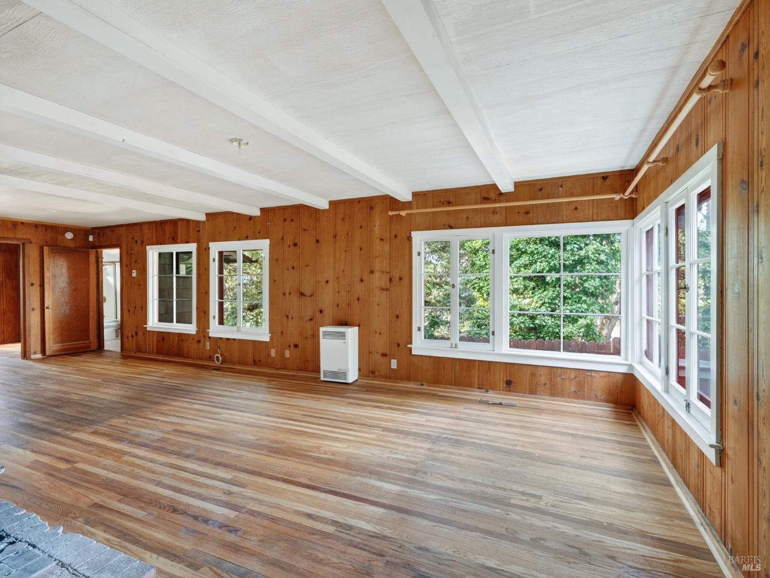10701 Orr Springs Road Ukiah, CA 95482 - Photo 9 of 52 a view of empty room with wooden floor and fan