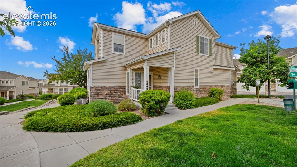 4023 Diamond Ridge View Colorado Springs, CO 80918 - Photo 3 of 31 a view of a house with a yard