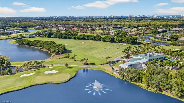 an aerial view of lake residential houses with outdoor space and swimming pool