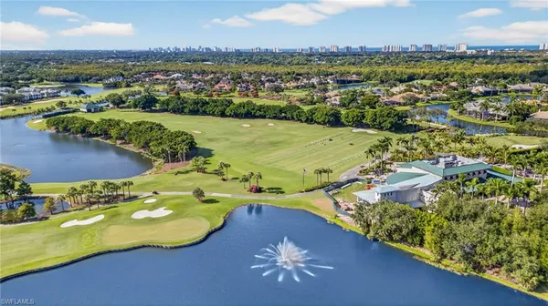 an aerial view of lake residential houses with outdoor space and swimming pool