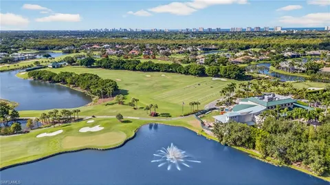 an aerial view of lake residential houses with outdoor space and swimming pool