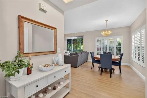 a view of a dining room with furniture and window