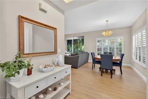 a view of a dining room with furniture and window