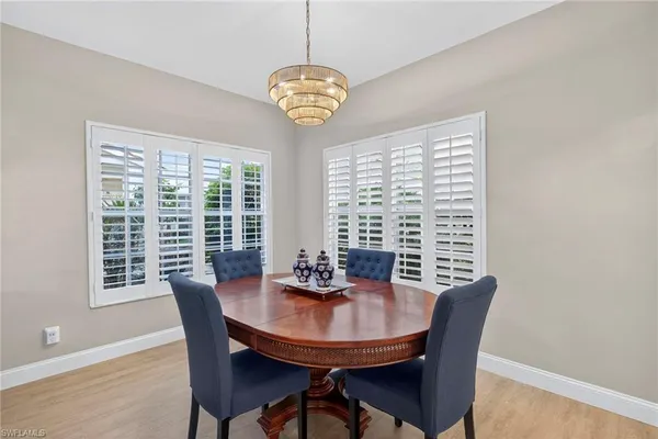 a view of a dining room with furniture window and outside view