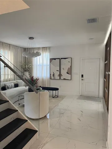 a living room with furniture and a table