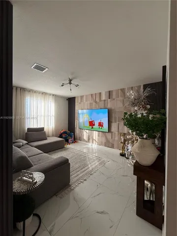 a large white kitchen with a large window