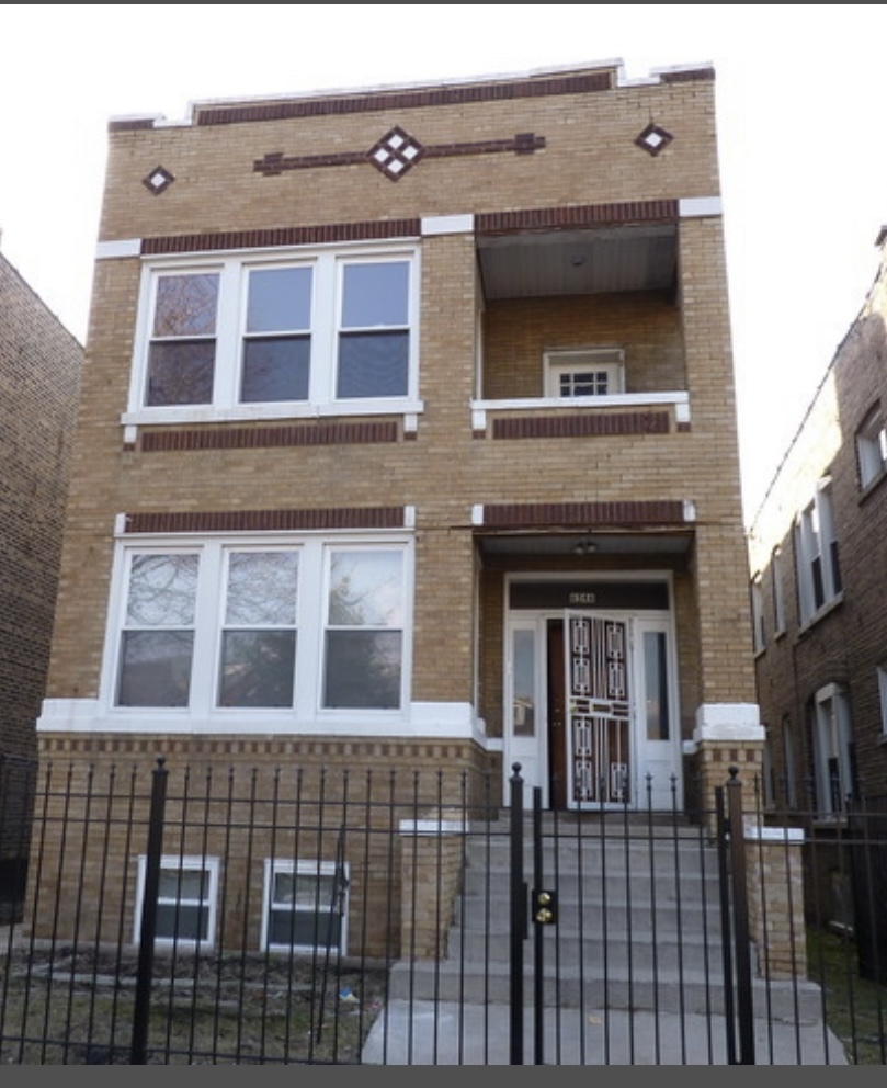 6546 South Rockwell Street, Unit 2 Chicago, IL 60629 - Photo 1 of 11 a front view of a building