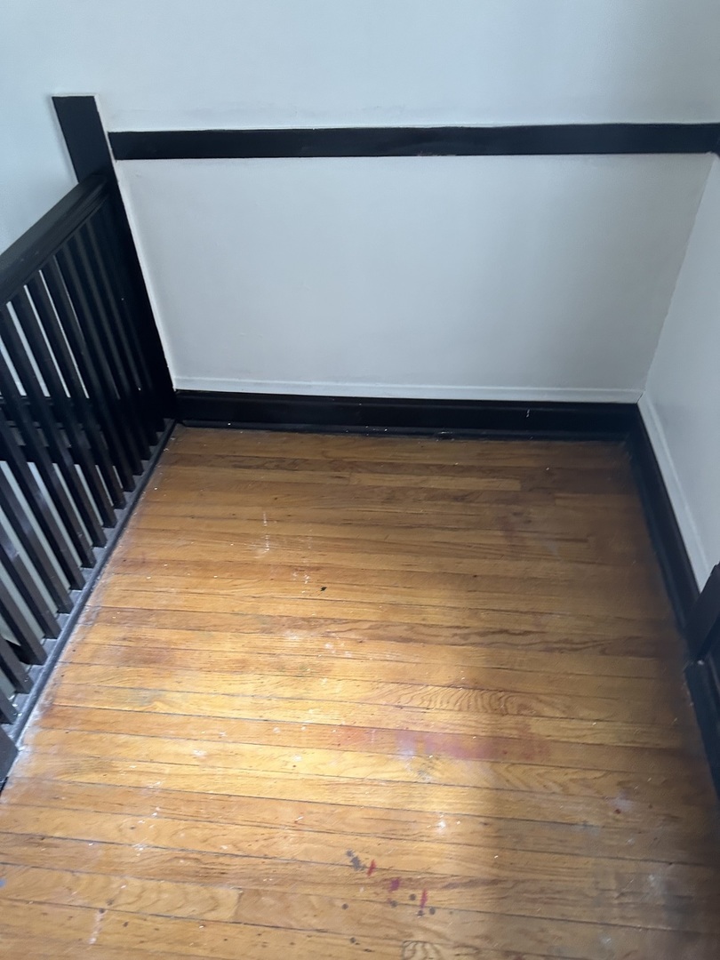 6546 South Rockwell Street, Unit 2 Chicago, IL 60629 - Photo 3 of 11 a view of room with wooden floor and window