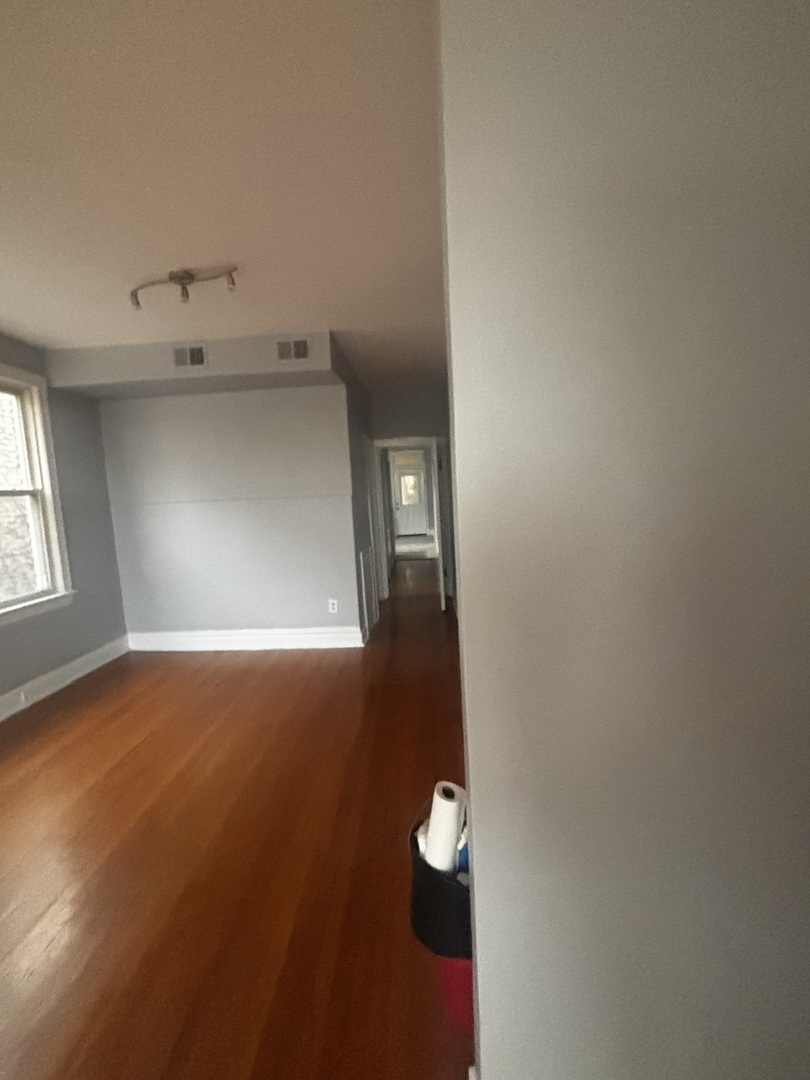 6546 South Rockwell Street, Unit 2 Chicago, IL 60629 - Photo 6 of 11 an empty room with windows and closet