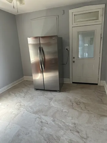 an empty room with a fireplace