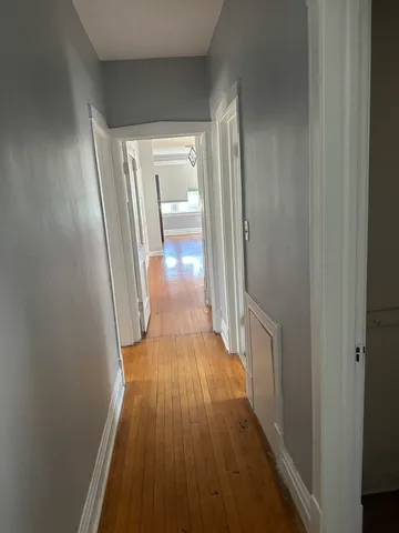 a view of gallery with wooden floor