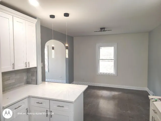 a view of a kitchen with a sink and dishwasher