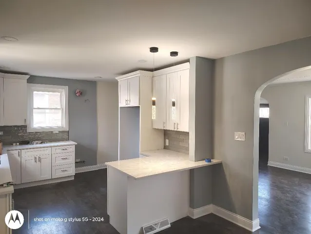 a large bathroom with a sink and a mirror