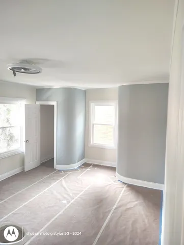 a view of entryway with wooden floor