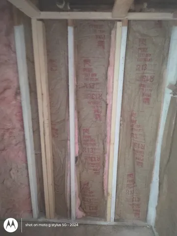 a view of a livingroom with table and chairs