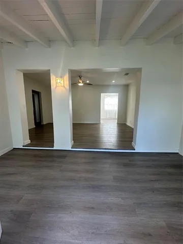 a view of livingroom and hall with wooden floor