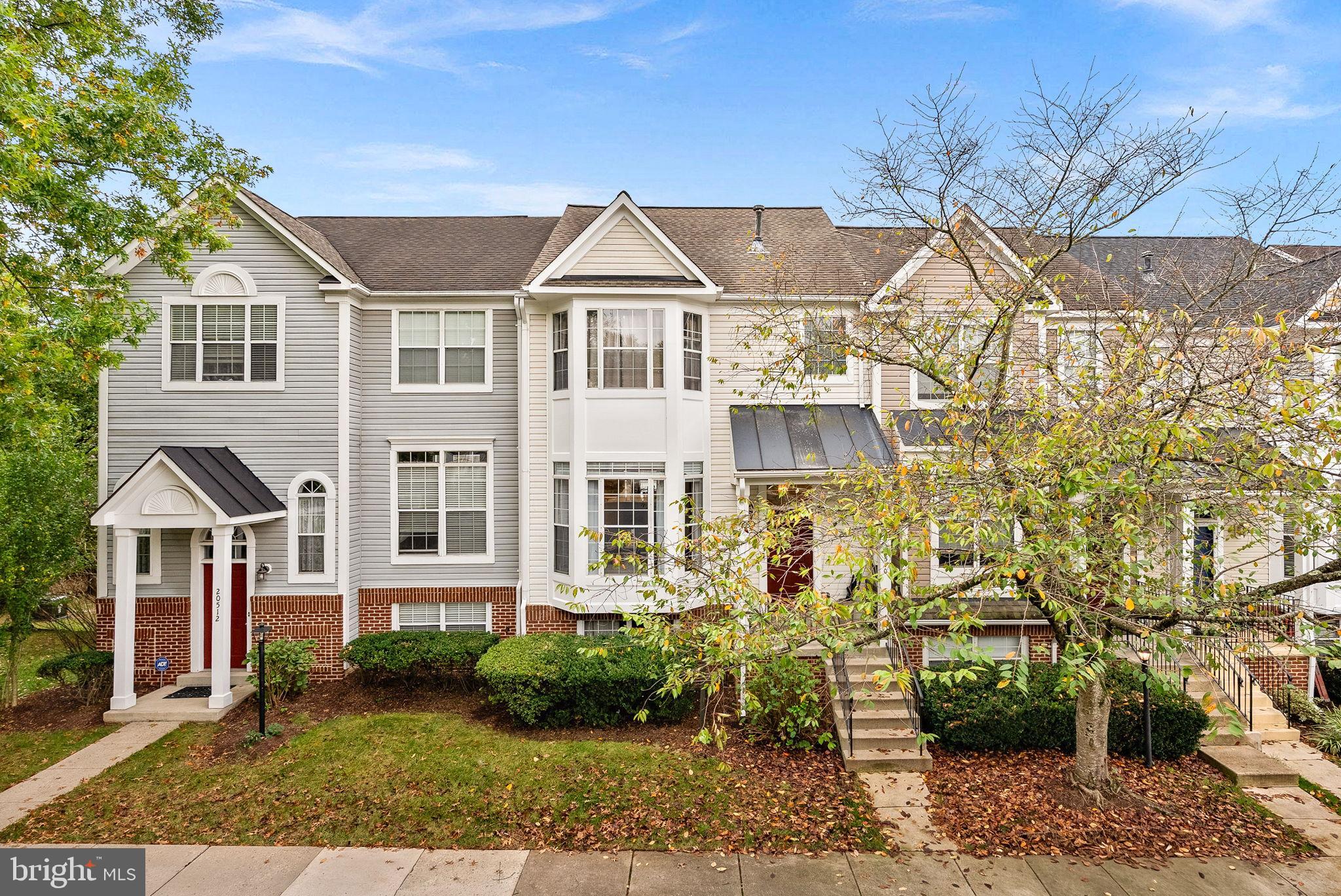 Charming townhouse with inviting curb appeal.