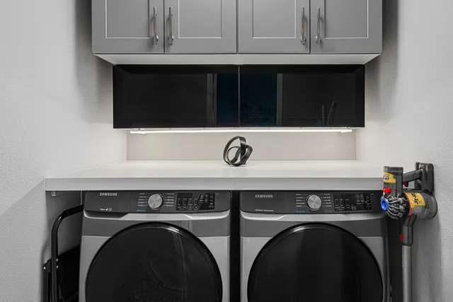 a utility room with dryer and washer