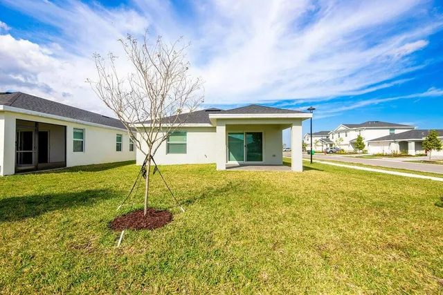 a house view with swimming pool
