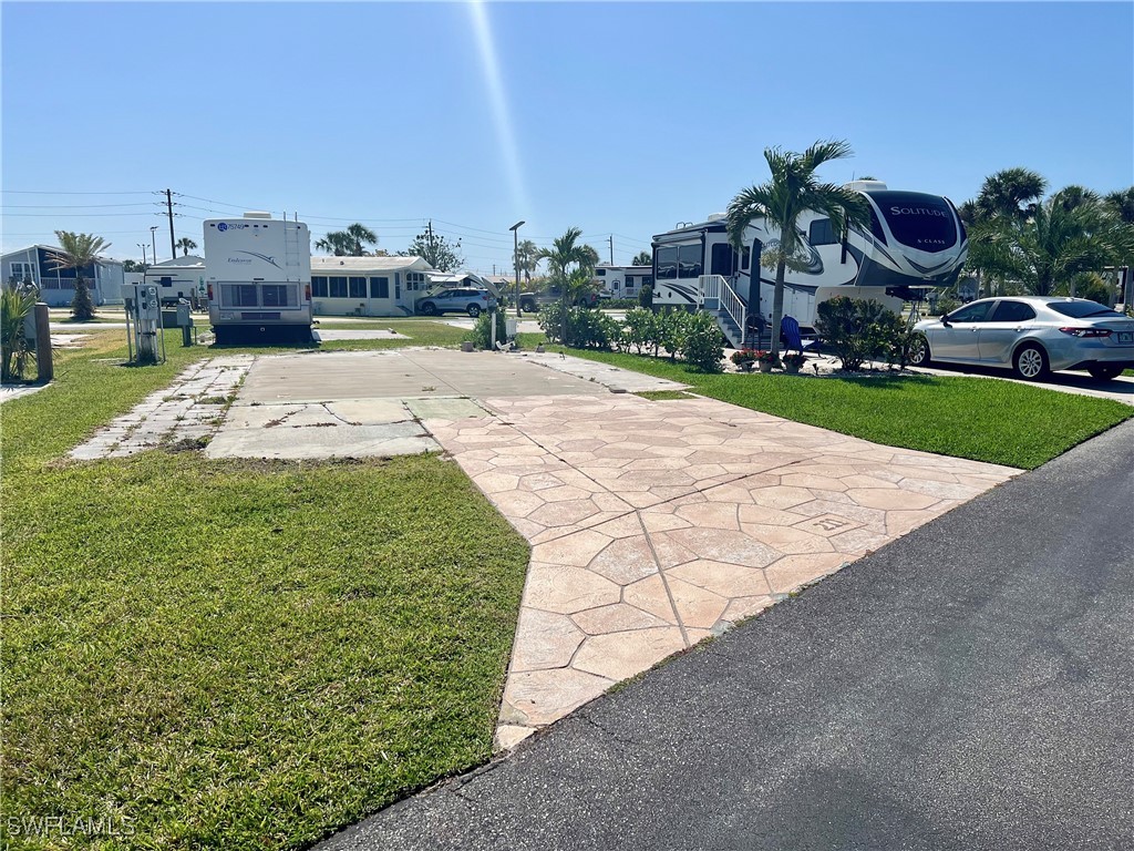 19681 Summerlin Road, Unit 211 Fort Myers, FL 33908 - Photo 1 of 21 a view of a street with a building in the background