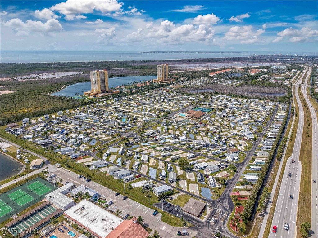 19681 Summerlin Road, Unit 211 Fort Myers, FL 33908 - Photo 13 of 21 a view of a lake with a building