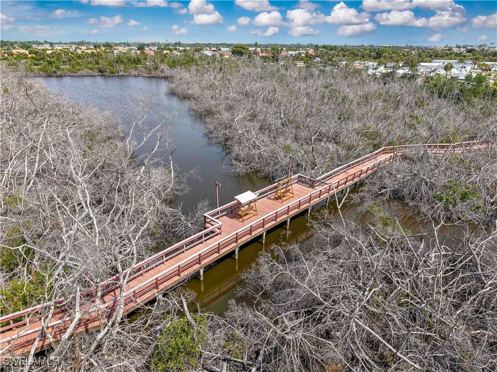 19681 Summerlin Road, Unit 211 Fort Myers, FL 33908 - Photo 14 of 21 a view of a wooden bridge with lake view