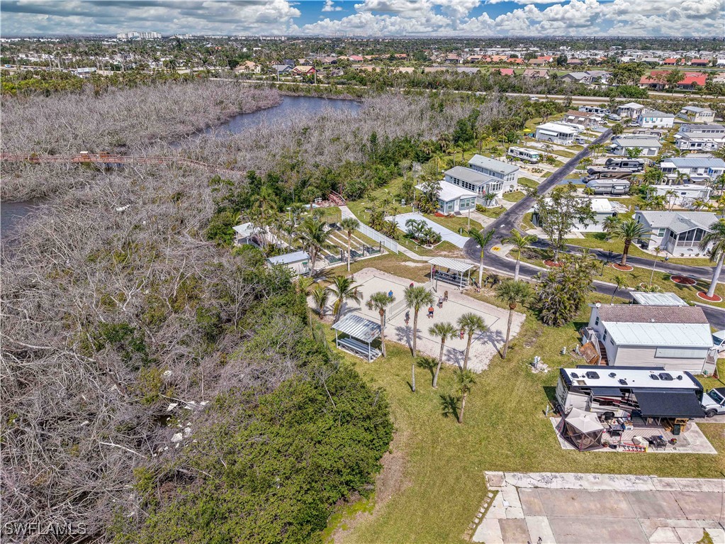 19681 Summerlin Road, Unit 211 Fort Myers, FL 33908 - Photo 16 of 21 an aerial view of residential house with outdoor space