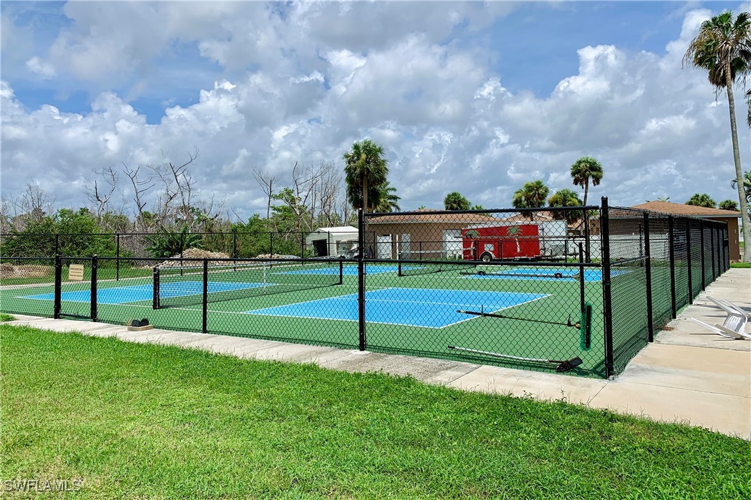 19681 Summerlin Road, Unit 211 Fort Myers, FL 33908 - Photo 18 of 21 a view of a park with a large tree