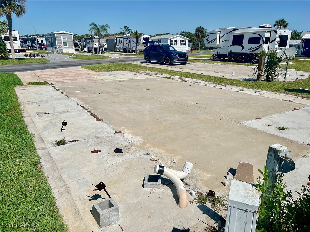 19681 Summerlin Road, Unit 211 Fort Myers, FL 33908 - Photo 3 of 21 a view of a backyard of a house