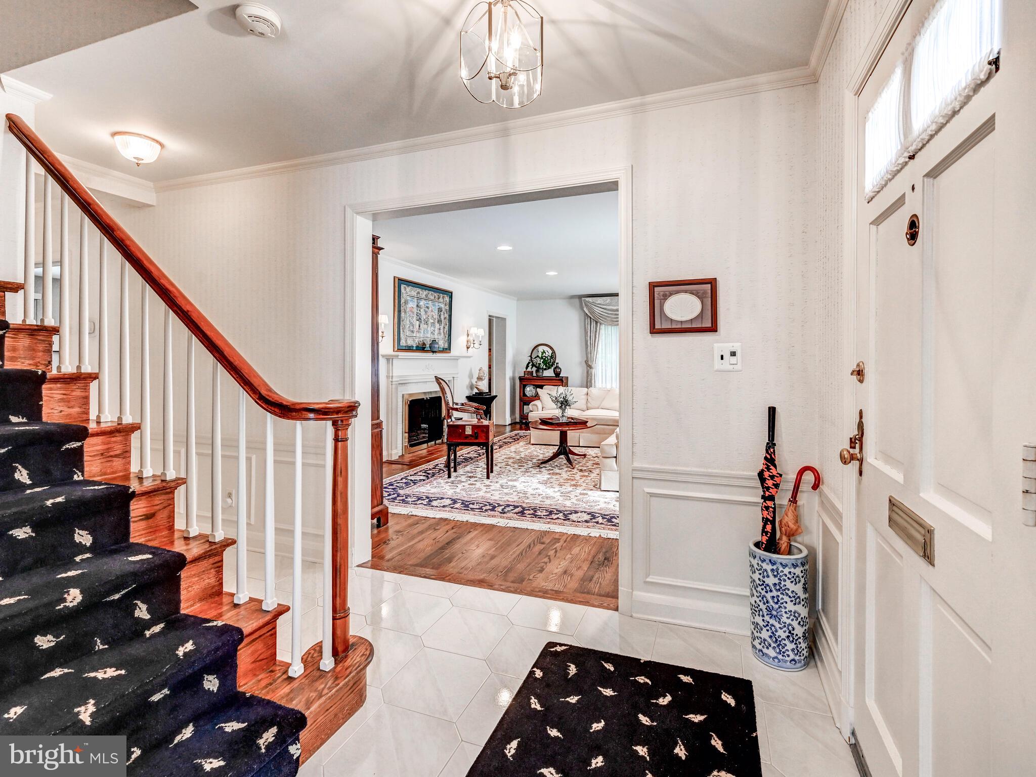 116 Castlewood Road Baltimore, MD 21210 - Photo 4 of 39 a hallway with wooden floor and furniture