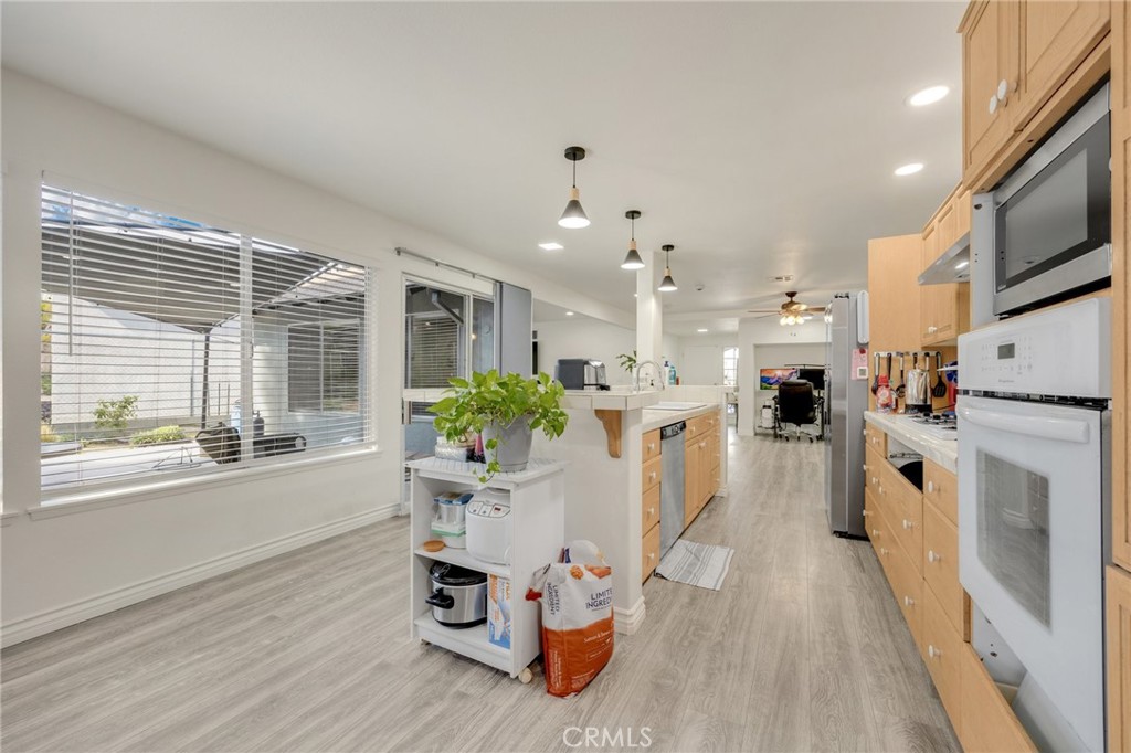 358 Lotus Place Brea, CA 92821 - Photo 12 of 31 a living room with furniture a fireplace and kitchen view